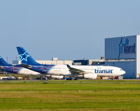 Air Transat aircraft in front of hangar