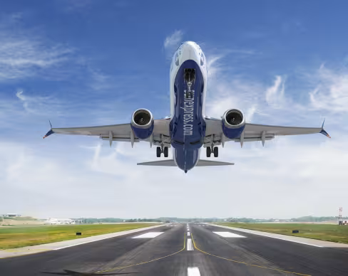 Aicraft with SunExpress livery taking off the runway